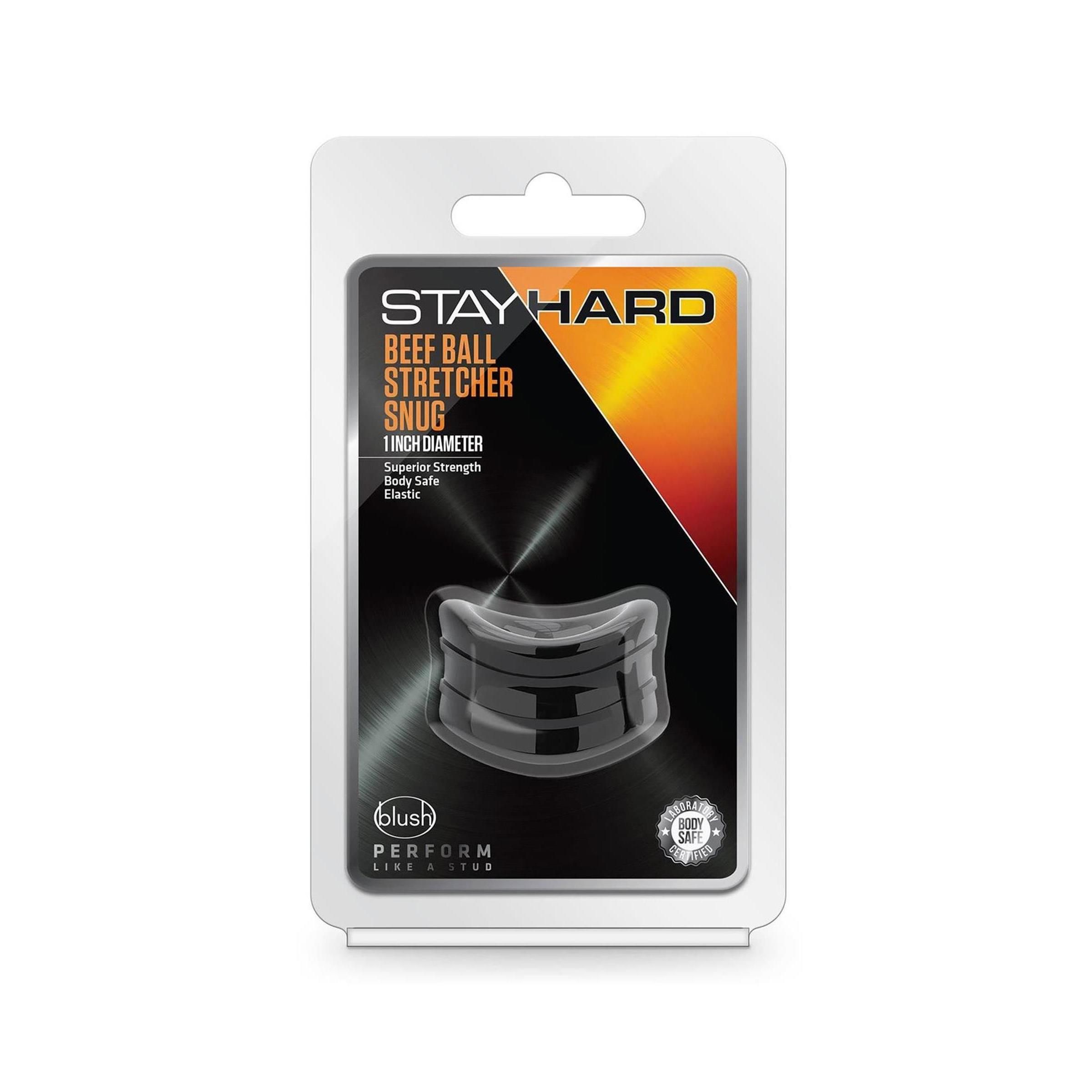 Verpackung mit schwarzem Produkt. Text: STAY HARD BEEF BALL STRETCHER SNUG, 1 INCH DIAMETER. Marke: blush PERFORM.