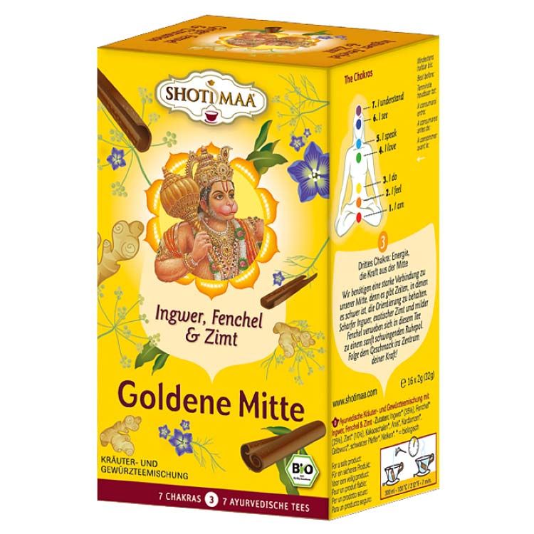 Gelbe Schachtel mit Aufschrift 'SHOTI MAA'. 'Goldene Mitte' und 'Ingwer, Fenchel & Zimt' sind sichtbar. Bio-Siegel.