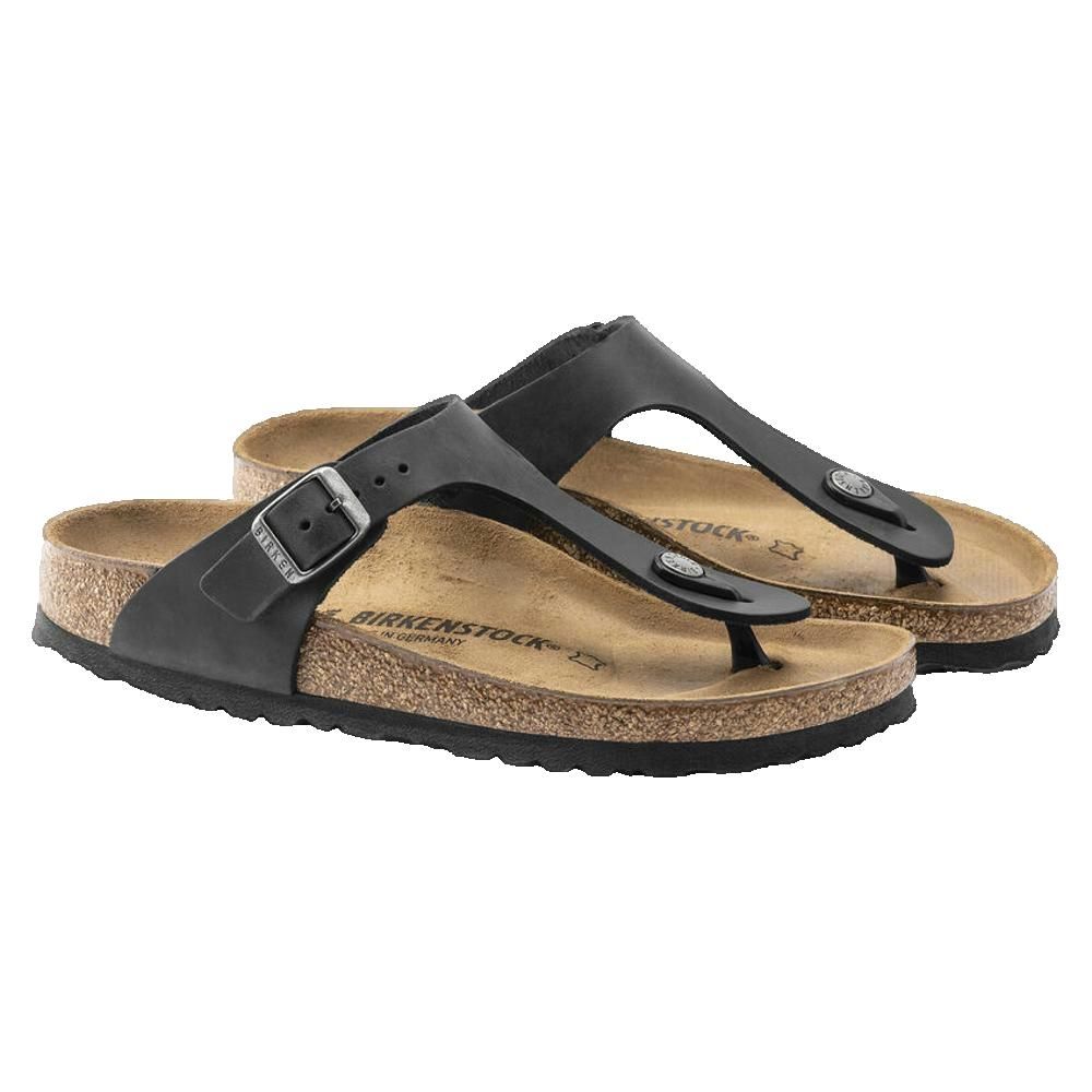 Paio di sandali Birkenstock neri con plantare in sughero e fibbie.