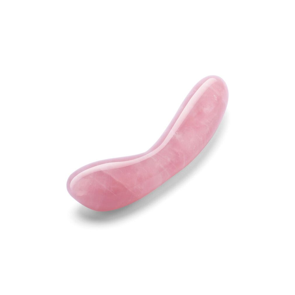 Rosa Kristall-G-Wand. Gebogene Form mit abgerundeten Enden. Glatte, polierte Oberfläche.