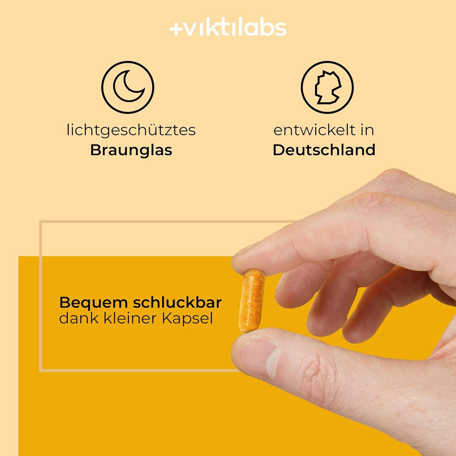 Hand hält eine Kapsel Viktilabs Vitamin B Komplex Forte. Hinweise auf Braunglas und Entwicklung in Deutschland.