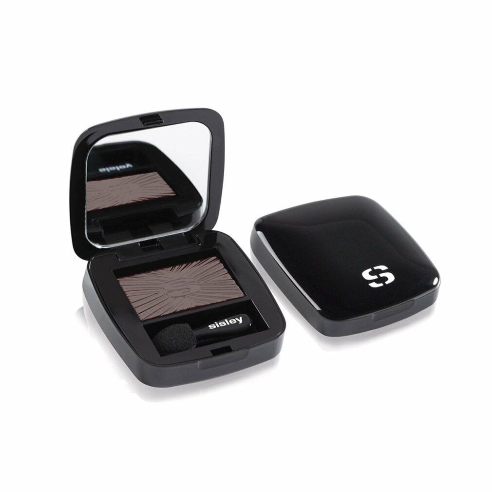 Geöffnete schwarze Lidschatten-Palette mit Spiegel und Applikator. Daneben der Deckel mit weißem Logo. Aufschrift: Sisley.