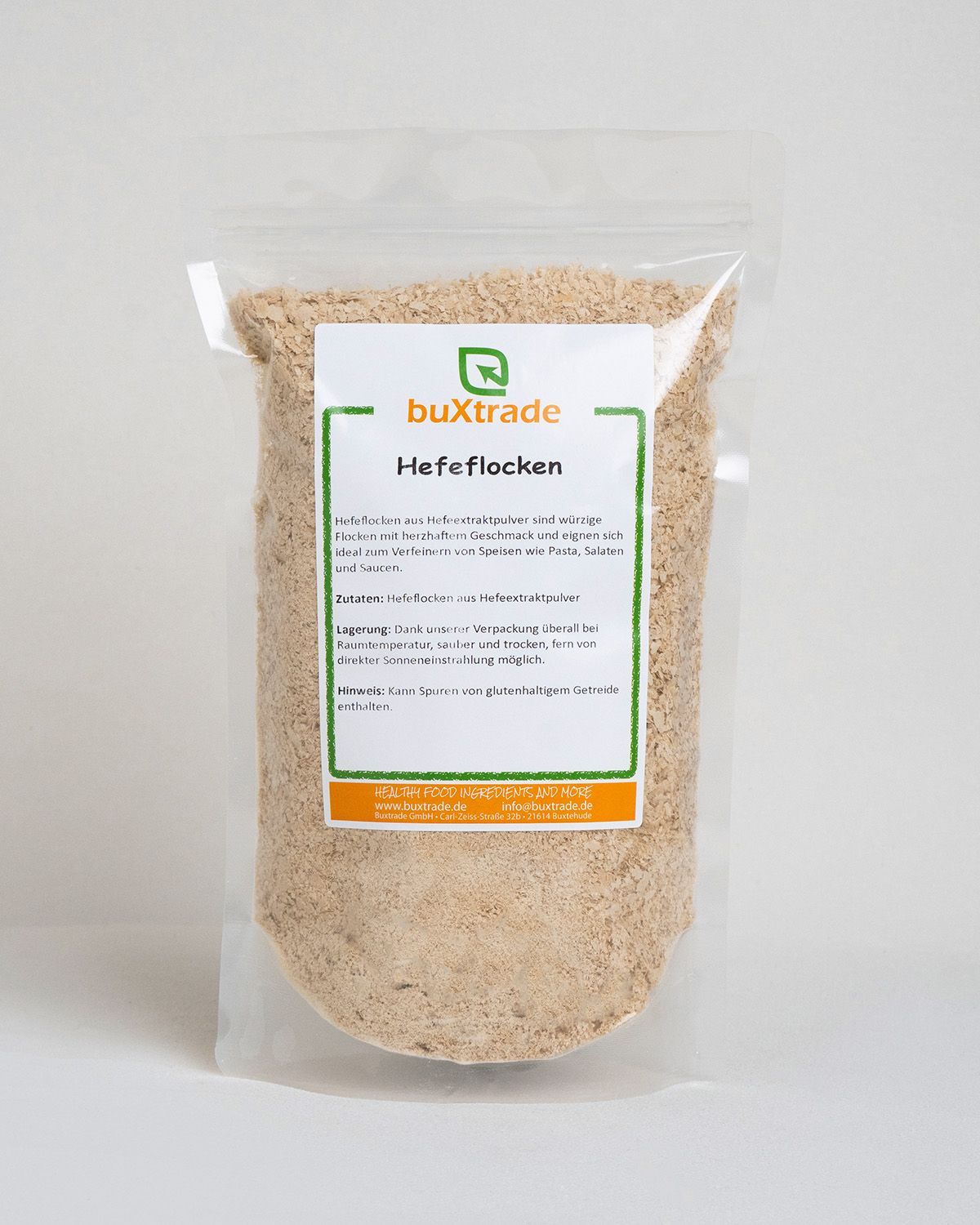 A bag of buXtrade Hefeflocken with a label detailing ingredients and storage.