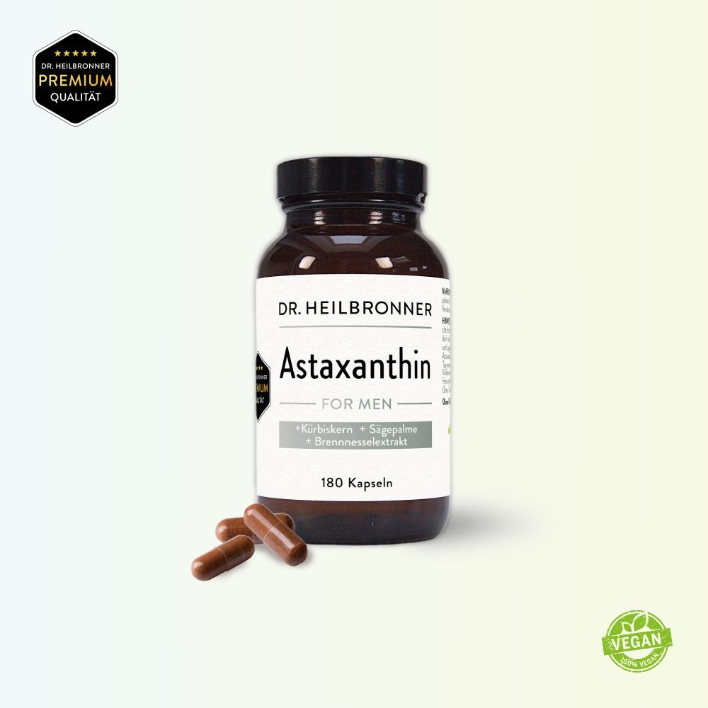 Braune Glasflasche mit Astaxanthin FOR MEN Kapseln und drei Kapseln daneben. Aufschrift: DR. HEILBRONNER, 180 Kapseln. Vegan-Siegel.
