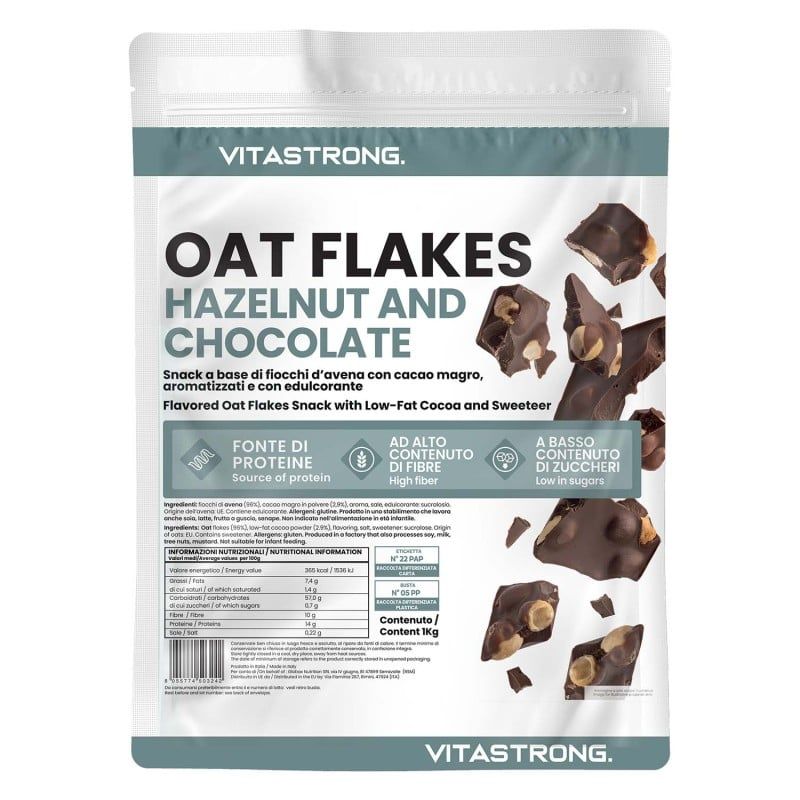 Vitastrong Oat Flakes, Haselnuss und Schokolade, in einer weißen Verpackung. Produktinformationen und Abbildung von Schokoladenstücken.
