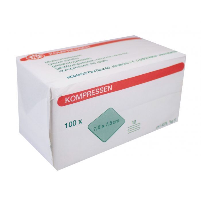 Weiße Verpackung mit roter und grüner Beschriftung. Aufschrift: KOMPRESSEN, 100 x, 7,5 x 7,5 cm. Marke NOBAMED.