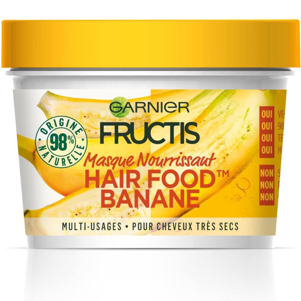 Gelber Tiegel Garnier Fructis Hair Food Banane. Aufschrift: Masque Nourrissant. Bananen-Illustrationen. 98% Naturel-Logo.