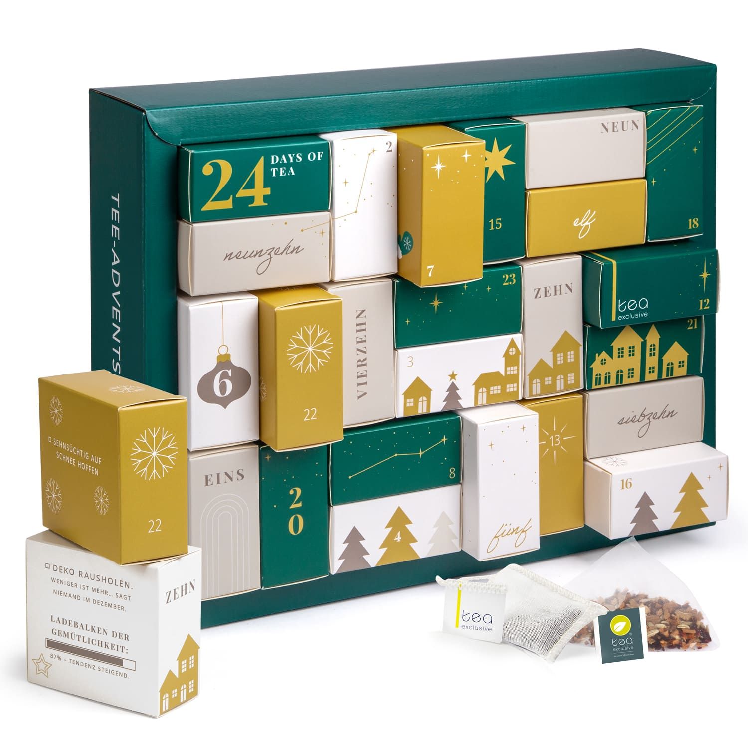 Ein grüner Tee-Adventskalender mit 24 kleinen Schachteln in Gold und Weiß, dekoriert mit Weihnachtsmotiven.