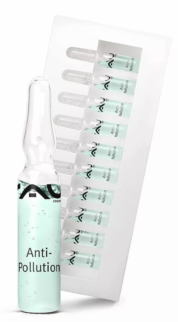 Eine Ampulle mit grüner Flüssigkeit und eine Packung mit weiteren Ampullen. Auf der Ampulle steht "Anti-Pollution".