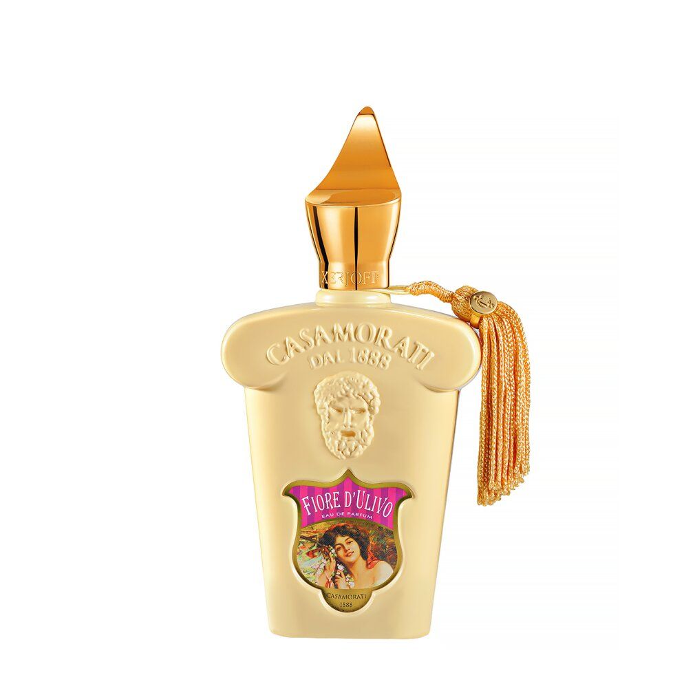 Beige Parfümflakon mit goldfarbenem Verschluss und Quaste. Aufschrift Fiore d'Ulivo und Casamorati.