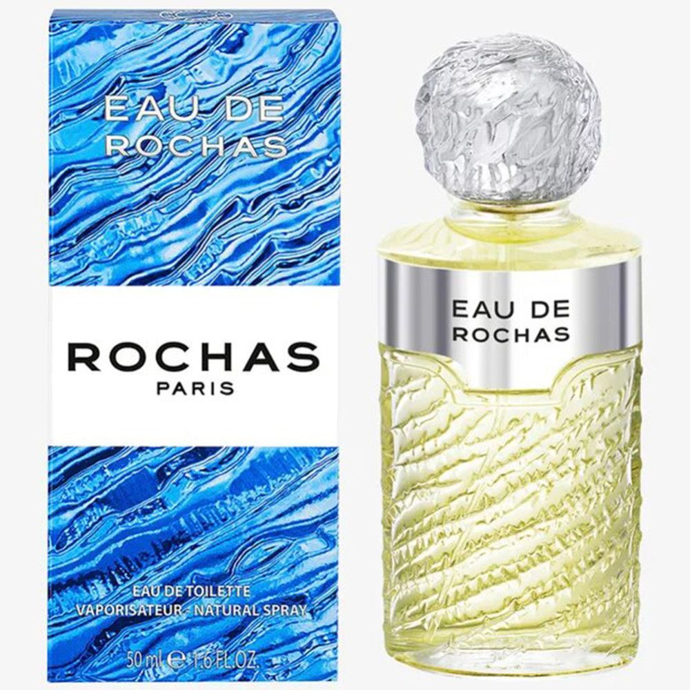 Eau de Rochas Flakon und Verpackung. Flakon mit silbernem Halsband und Deckel. Verpackung blau mit Wellenmuster.