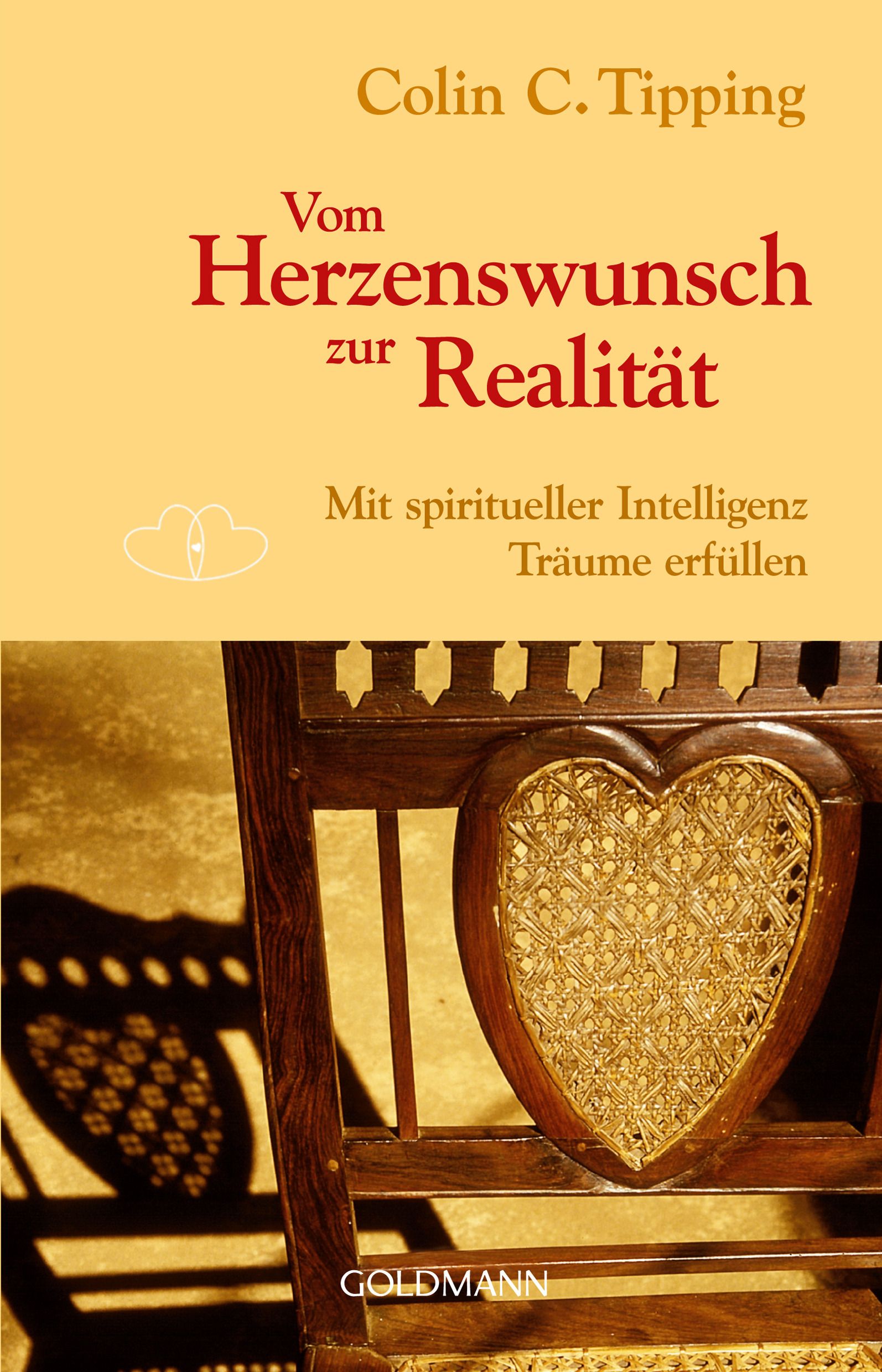 Buchcover: "Vom Herzenswunsch zur Realität". Autor: Colin C. Tipping. Goldmann Verlag. Abgebildet ist ein Stuhl mit Herzlehne.