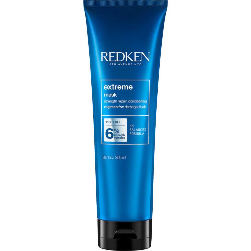 Blaue Tube mit Produktnamen und Text. Text: strength repair, conditioning regimen for damaged hair. 8.5 fl oz 250ml.