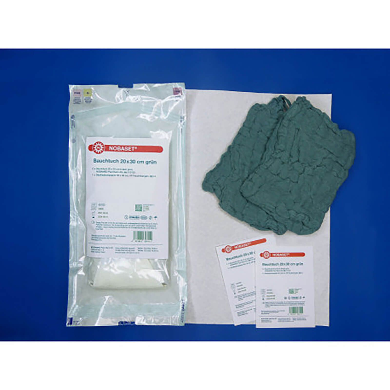 Verpackung mit NOBASET® Bauchtuch, grün. Enthält Tücher und Beipackzettel. Aufschrift: Bauchtuch 20x30 cm grün.