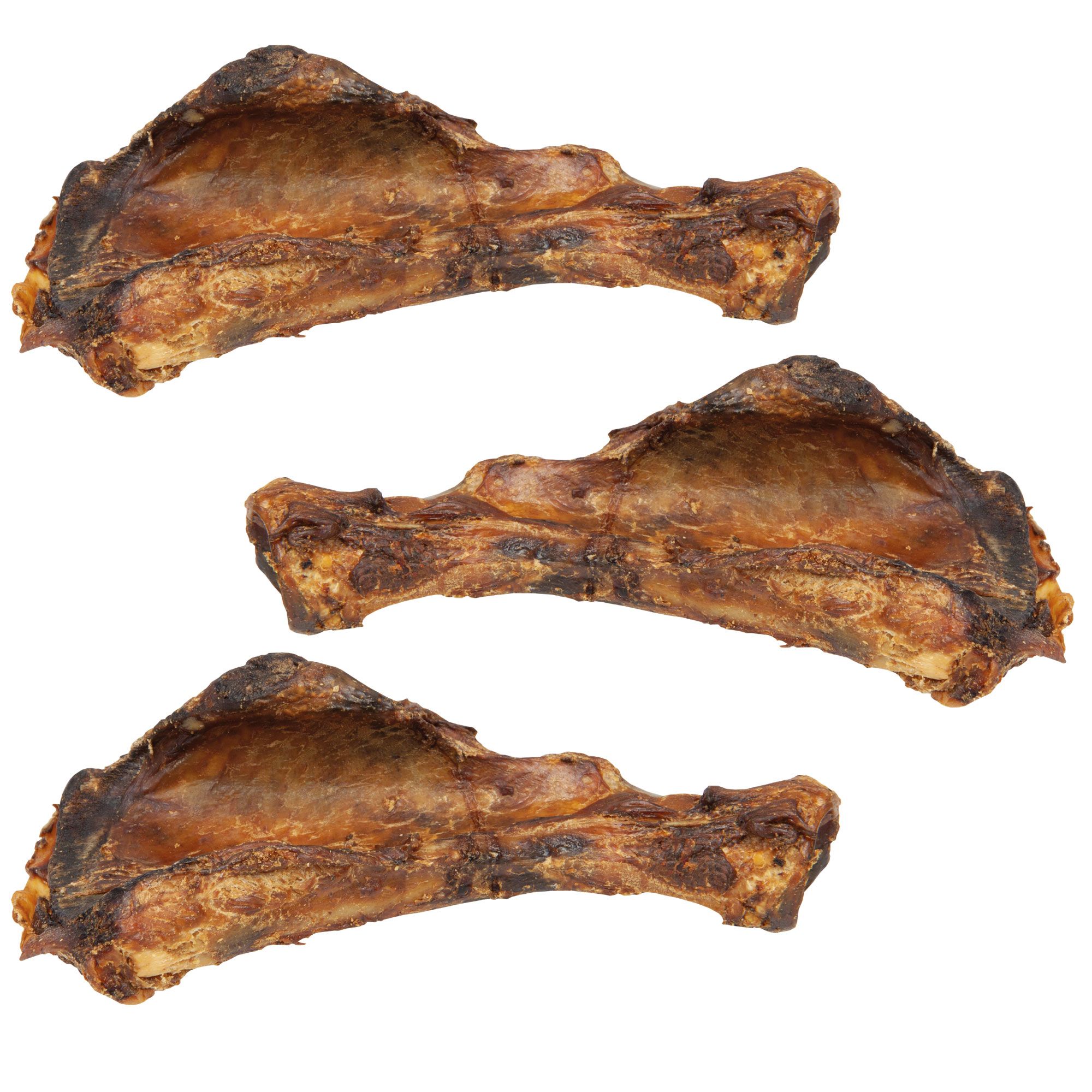 Drei getrocknete Schweineschulterblätter. Braune Farbe, unregelmäßige Form. Auf weißem Hintergrund.