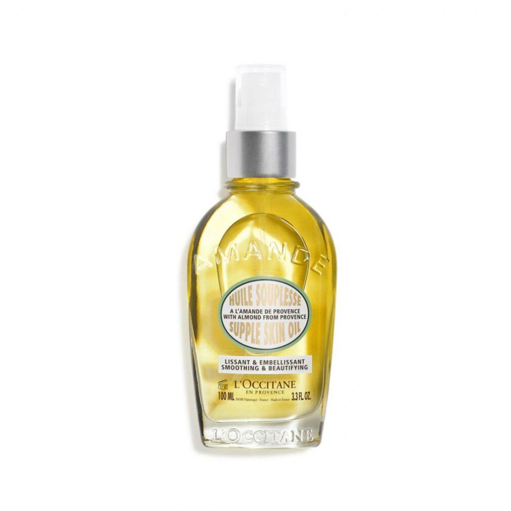 Klarflüssiges Öl in einer Glasflasche mit Sprühkopf. Aufschrift: Huile Souplesse, L'Occitane.