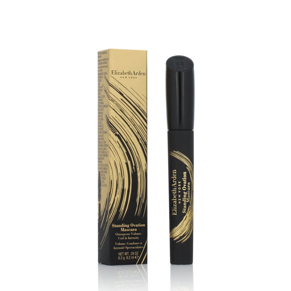 Elizabeth Arden Standing Ovation Mascara Black. Schwarze Mascara und goldfarbene Verpackung. Text: Produktname, Marke, Volumen.