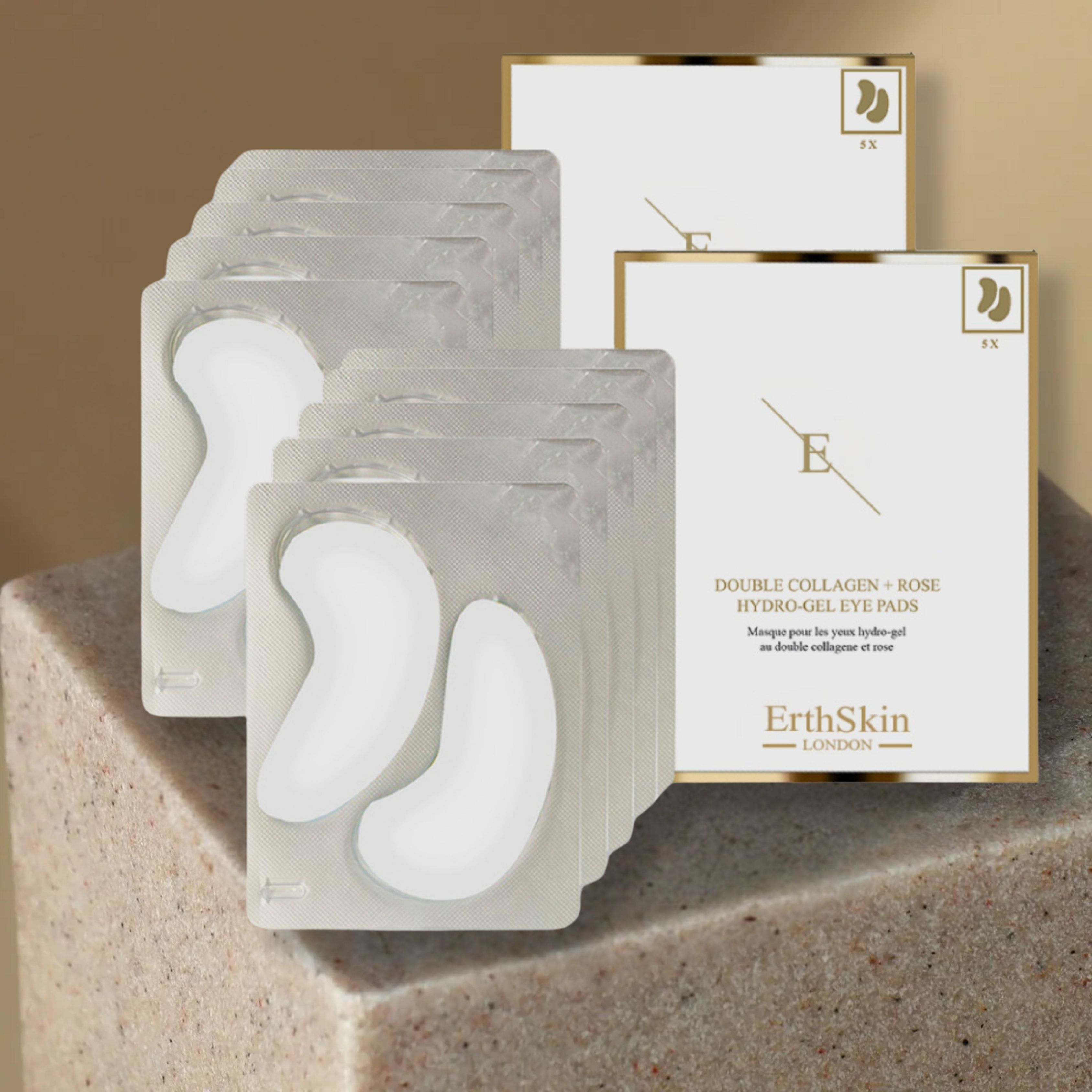 Emballage du produit avec patchs pour les yeux. Patchs blancs en forme de croissant dans des blisters transparents. Cadre doré.