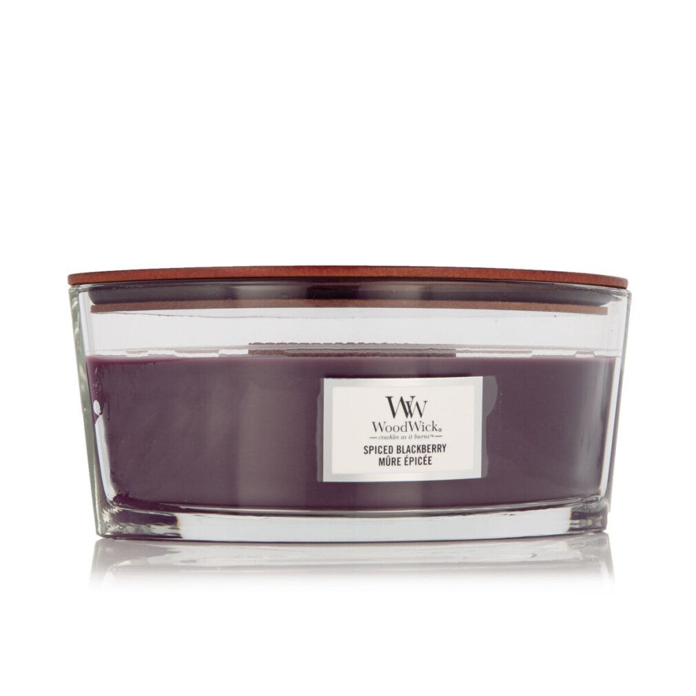 Ellipse-Kerze mit Holzdeckel. Violettes Wachs in Glasbehälter. Etikett "Spiced Blackberry". WW-Logo.