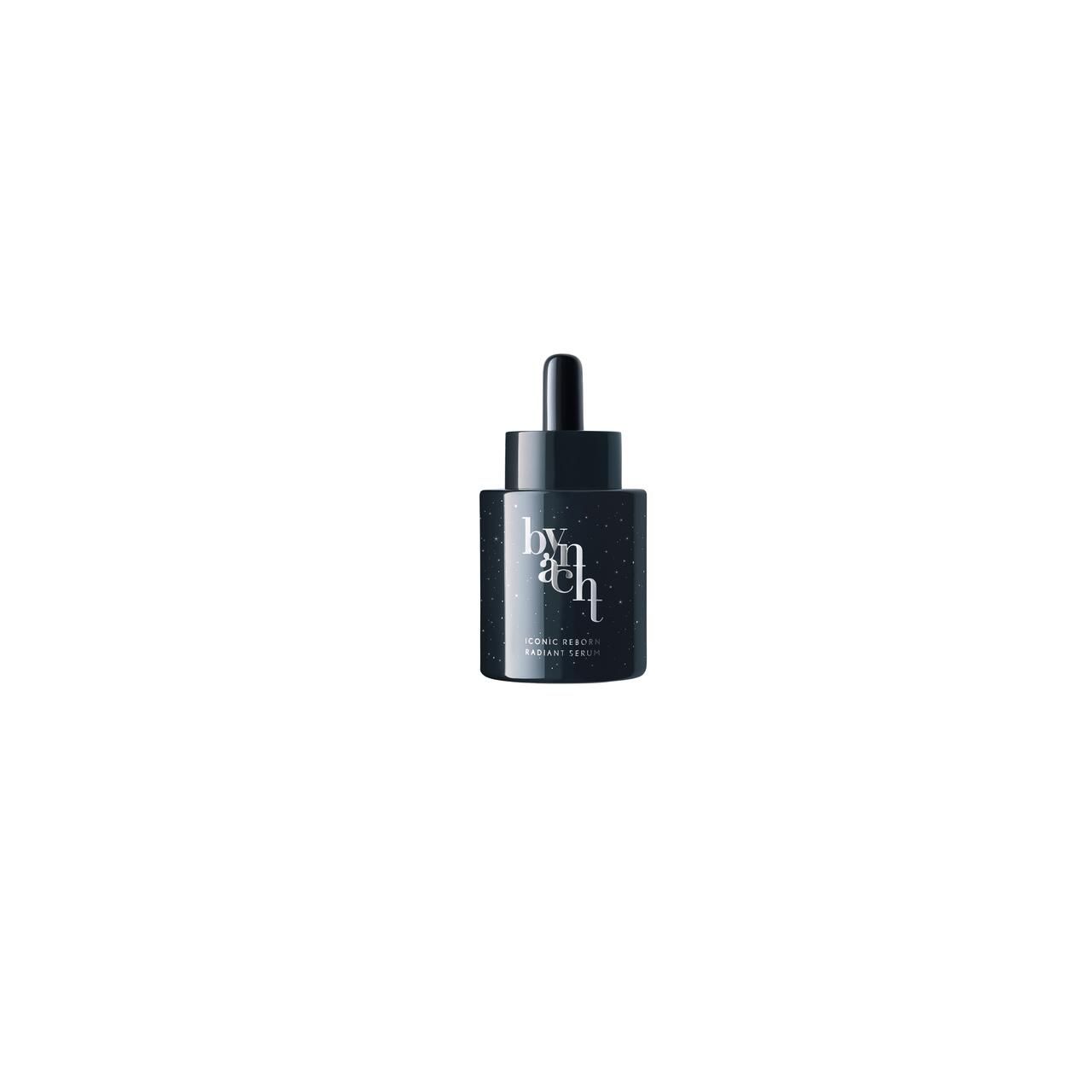 Kleine, dunkelblaue Serumflasche mit Pipette. Schriftzug 'bynacht' und 'ICONIC REBORN RADIANT SERUM'.