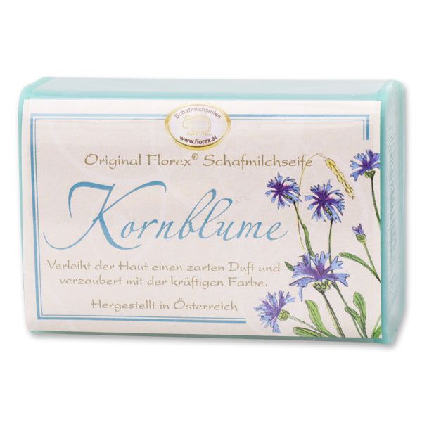 Verpackte Seife mit Etikett: Original Florex Schafmilchseife Kornblume. Mit Kornblumen-Illustration.