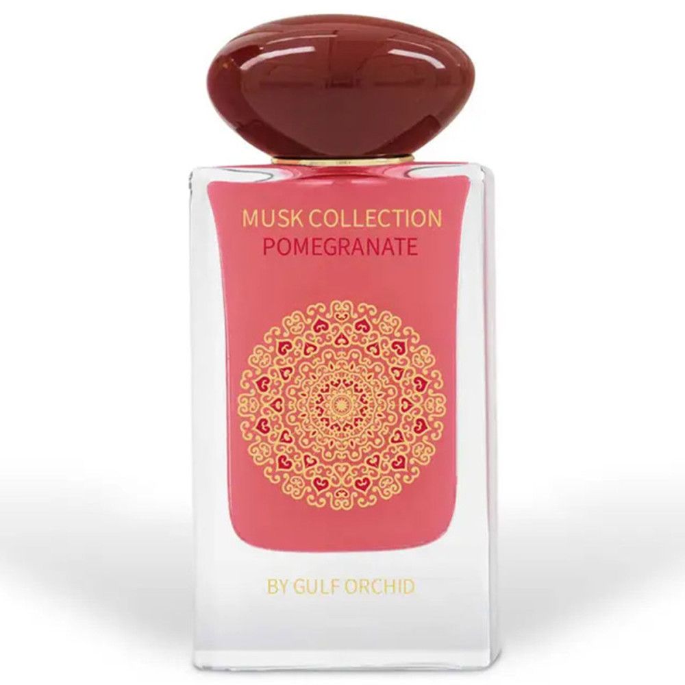 Parfümflakon mit roter Flüssigkeit, braunem Verschluss und goldfarbenem Etikett. Text: Musk Collection Pomegranate, By Gulf Orchid.