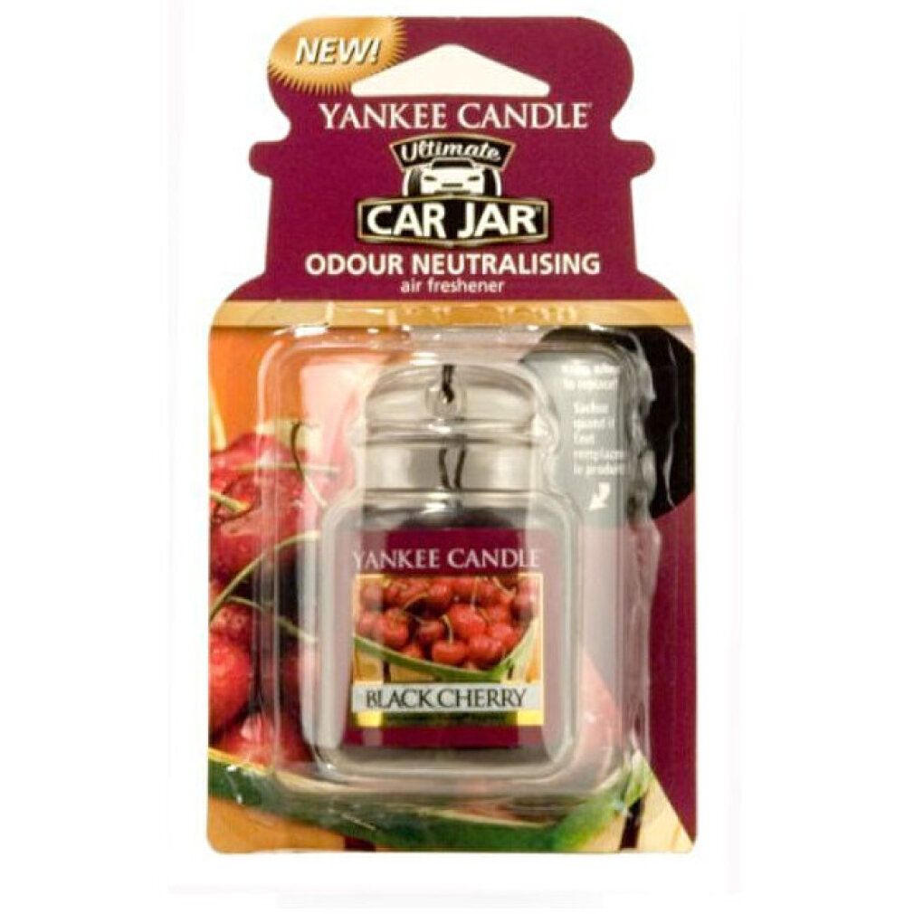 Yankee Candle Autoerfrischer. Schwarze Kirsche. In Verpackung. Klares Glasgefäß mit Metallverschluss. Kirschabbildung. "NEW!" Aufkleber.