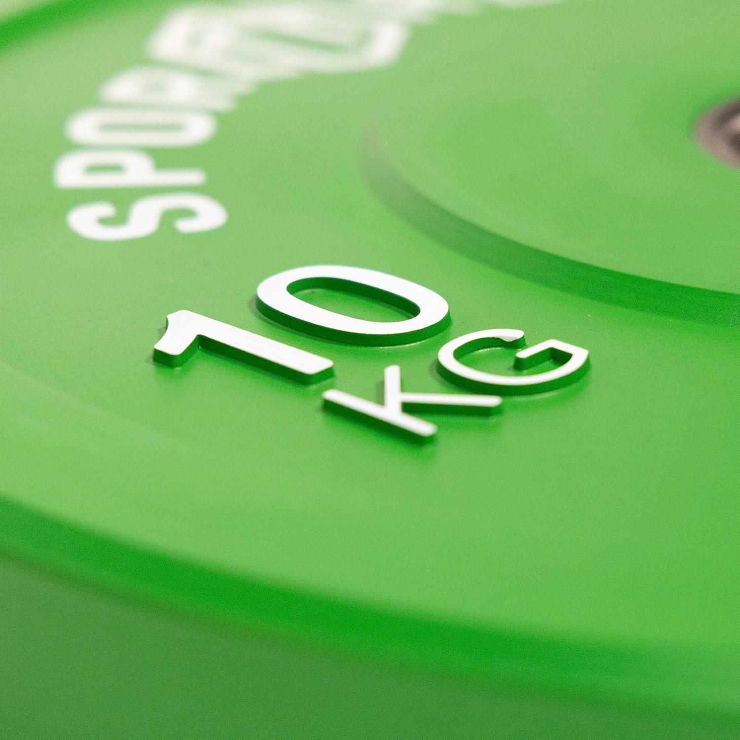 Nahaufnahme einer grünen Sporttrend24 Bumper Plate. Gewicht: 10 kg. Weiße Schrift.