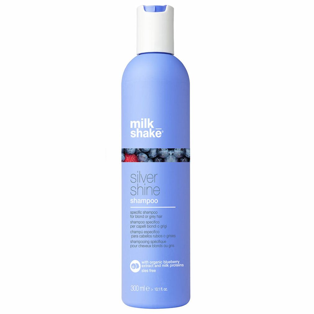 Blaues Shampoo-Fläschchen mit weißem Deckel. Aufschrift: milk_shake, Silver Shine Shampoo. Mehrsprachiger Text.