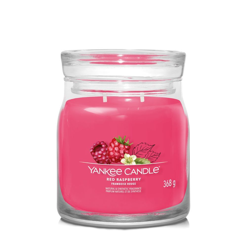 Rote Kerze im Glas. Aufkleber mit Himbeeren und Blättern. Text: Red Raspberry, 368g, Yankee Candle.