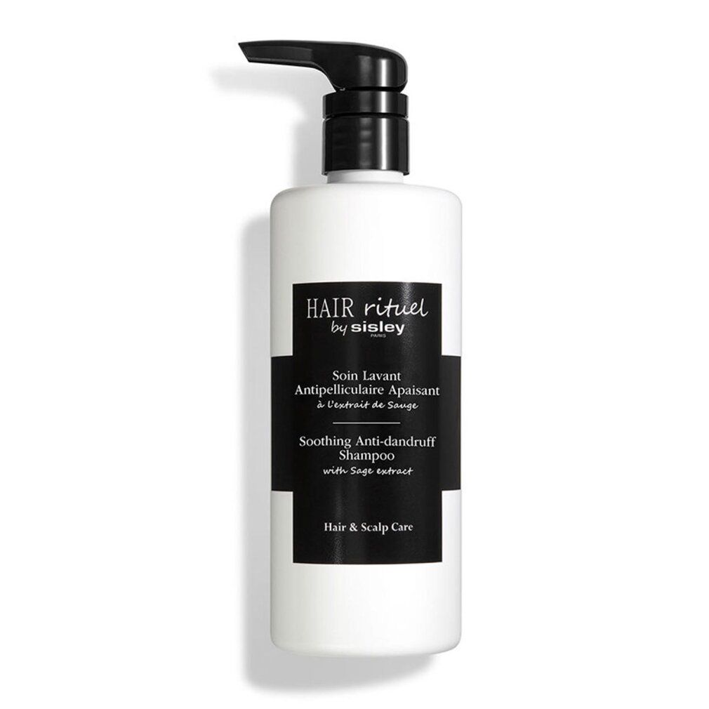 Weißer Behälter mit schwarzem Pumpkopf. Schwarzes Etikett mit Text: Hair Rituel by Sisley, Soin Lavant Antipelliculaire Apaisant, Soothing Anti-dandruff Shampoo.