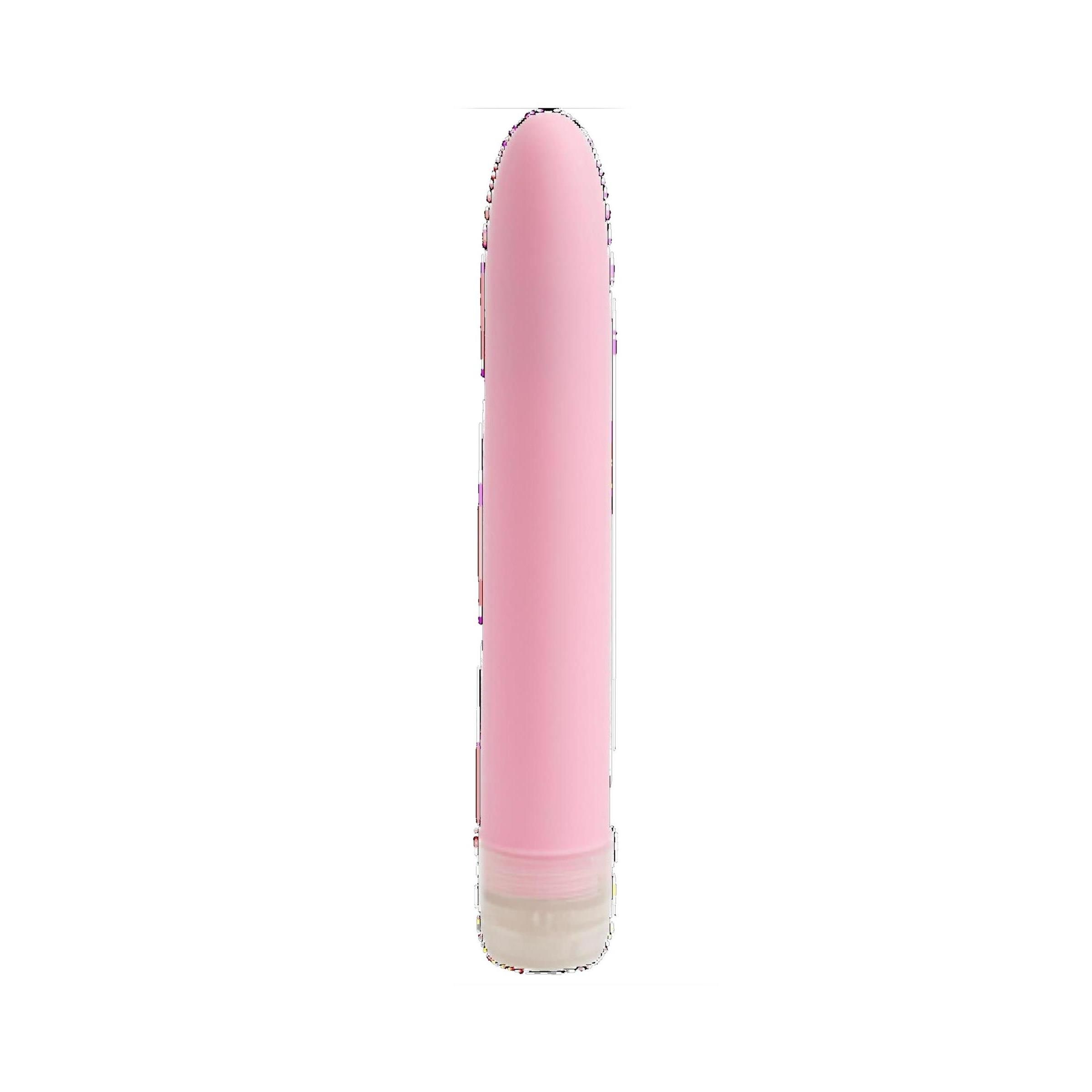 Rosa Vibrator. Zylindrische Form, abgerundete Spitze. Transparenter Sockel.