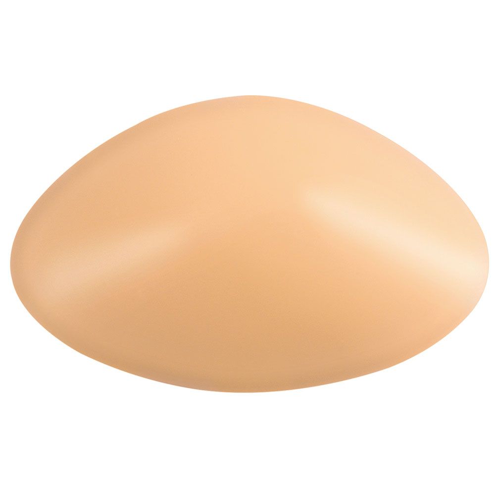 Ausgleichsepithese, beige, ovale Form. Oberseite glatt, Unterseite leicht gewölbt.