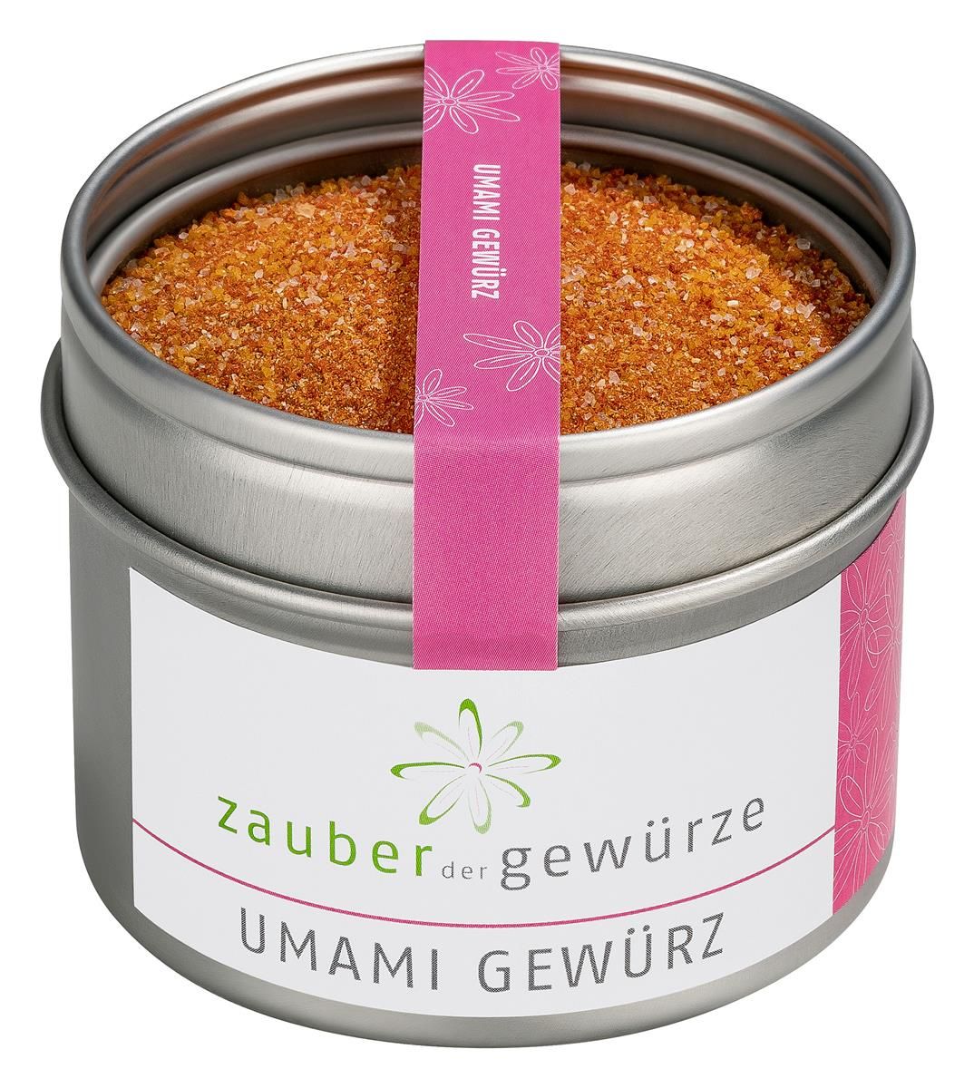 Runde Dose mit Umami Gewürz. Rosa Band mit Schriftzug. Weißes Etikett mit Logo und Schriftzug 'Zauber der Gewürze Umami Gewürz'.