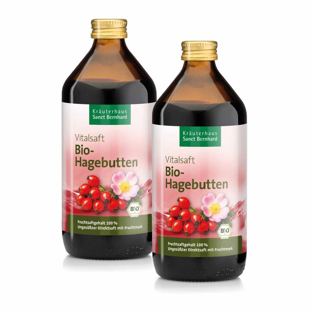 Zwei Flaschen Bio-Hagebutten-Vitalsaft von Sanct Bernhard, braunes Glas, goldener Verschluss.