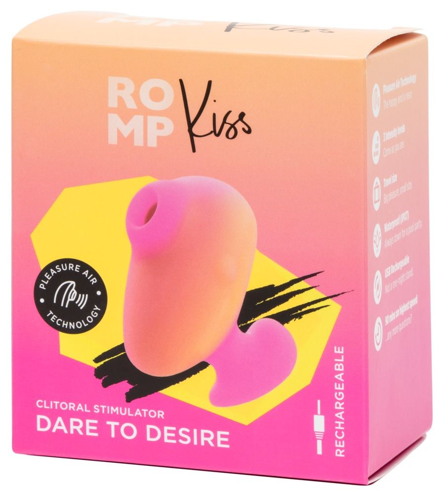 Verpackung mit Produkt. Rosa-gelbes Gerät mit Herzform. Text: ROMP Kiss, Clitoral Stimulator, Dare to Desire, Rechargeable.