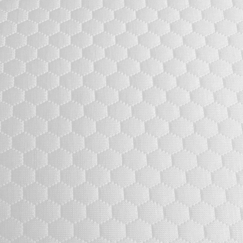 Gros plan d'une surface textile blanche à motif en nid d'abeille. Motif uniforme, pas d'autres éléments.