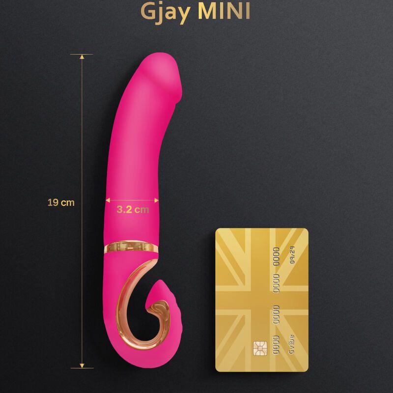 Pinkfarbener Silikonvibrator mit goldfarbenen Akzenten. Maße: 19 cm lang, 3,2 cm breit. Neben einer Kreditkarte zur Größenveranschaulichung.