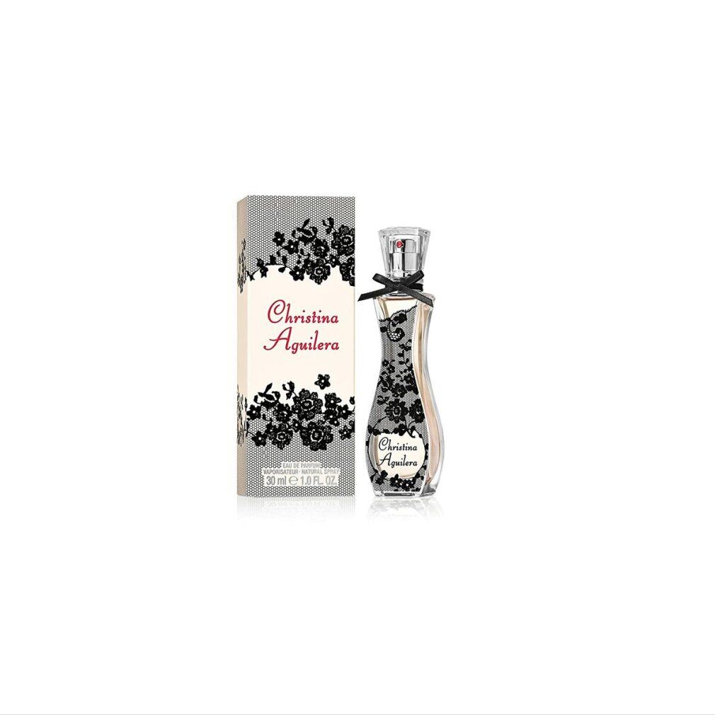 Parfümflasche und Verpackung. Flasche mit Spitzenmuster und Schleife. Verpackung mit Aufschrift: Christina Aguilera.