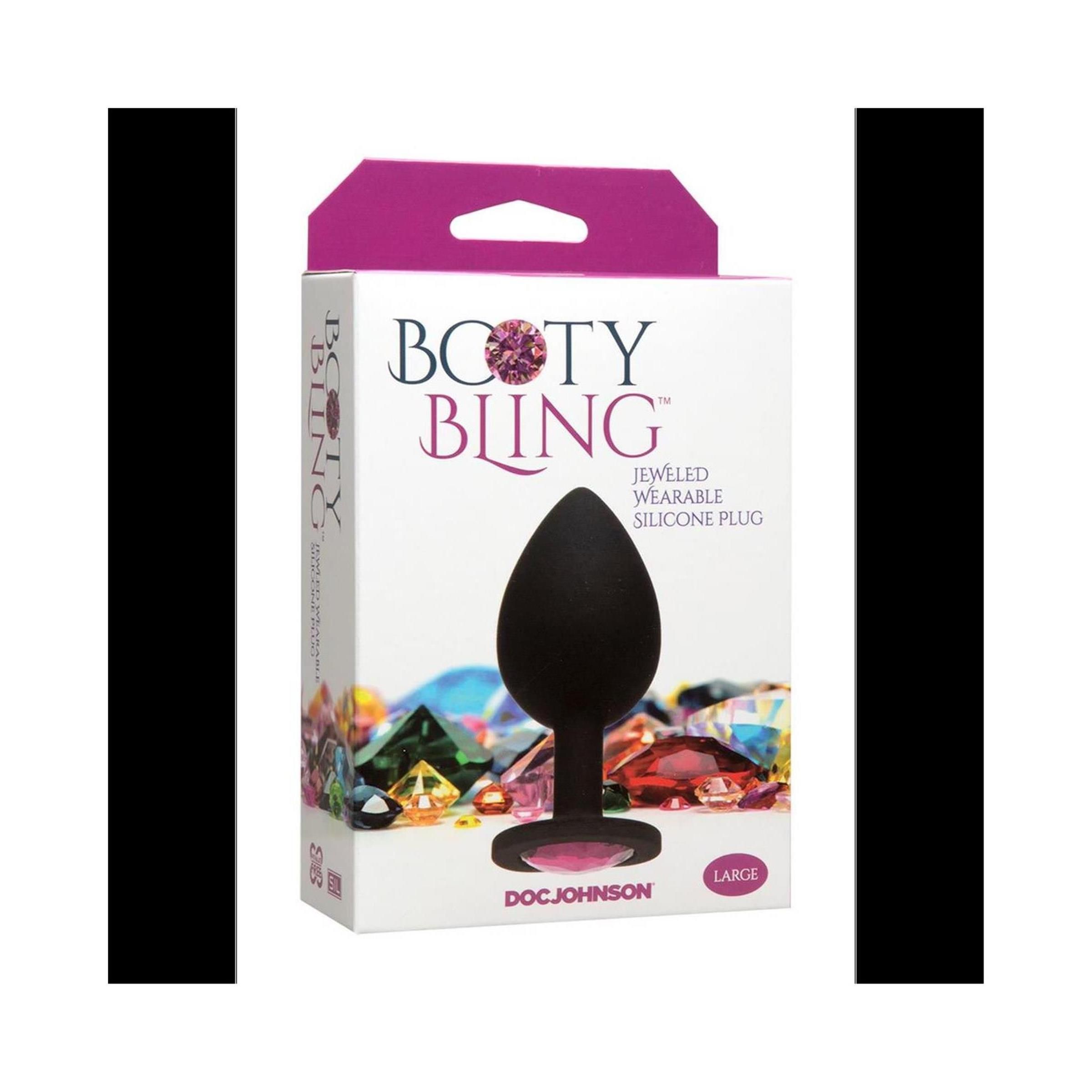 Verpackung mit schwarzem, juwelenbesetztem Plug. Aufschrift: Booty Bling, Jewelled Wearable Silicone Plug. Marke: Doc Johnson. Größe: Large.