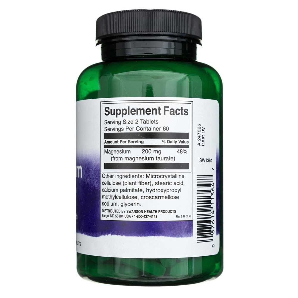 Grüne Flasche mit Nahrungsergänzungsmitteln, Etikett mit "Supplement Facts" und Magnesiumangaben.