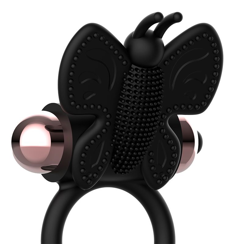 Schwarzer Vibrator in Schmetterlingsform mit Ringen und metallischen Kugeln.