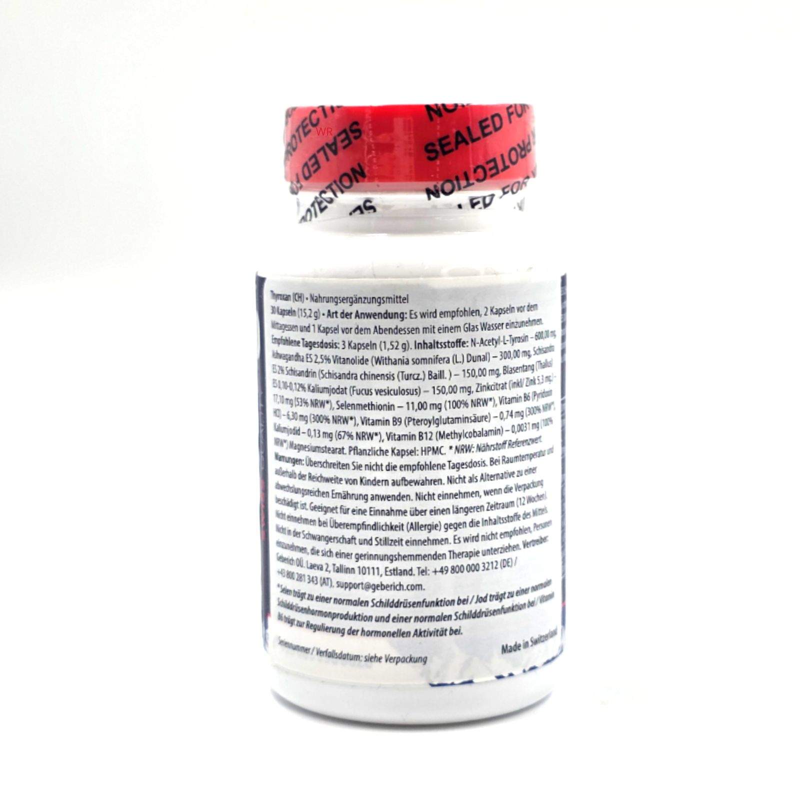Weiße Flasche mit rotem Deckel. Rückseite mit Inhaltsangaben und Herstellerinformationen. Text in deutscher Sprache.