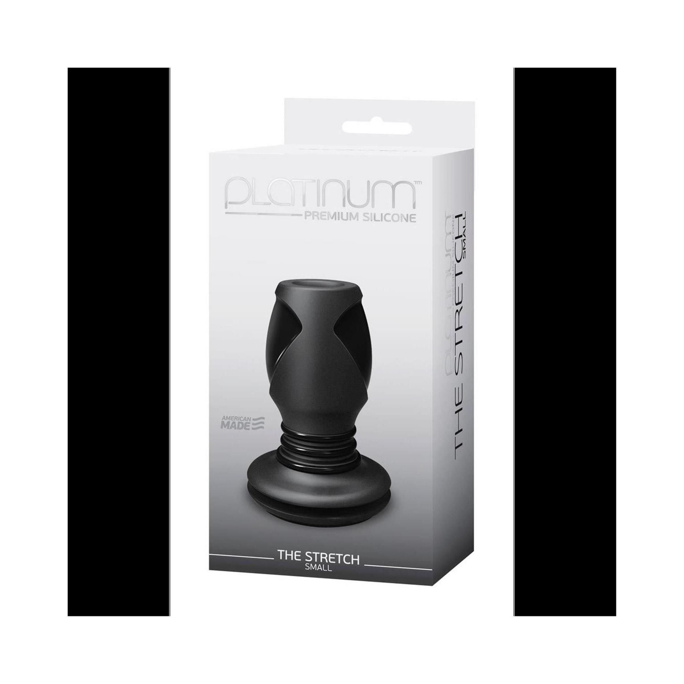 Schwarzer Butt Plug in Verpackung. Produktname: The Stretch. Marke: Platinum. Material: Silikon. Verpackung mit Produktabbildung und Text.