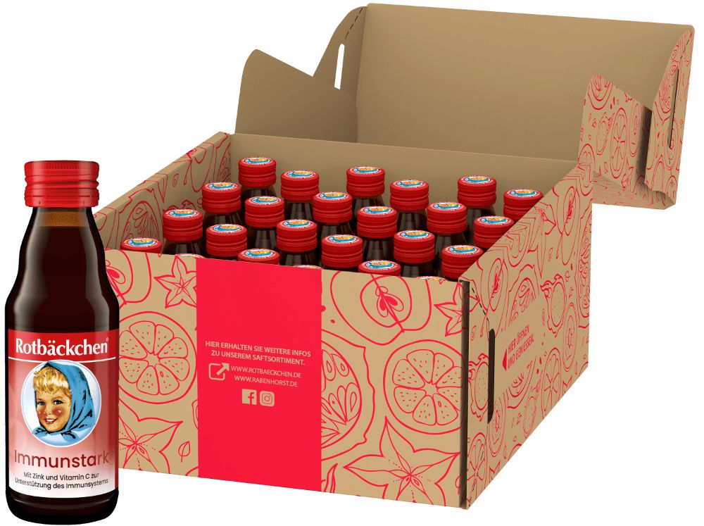 Geöffnete Kartonbox mit Flaschen Rotbäckchen Immunstark Mini. Eine Flasche steht davor. Rote Deckel, Etiketten sichtbar.