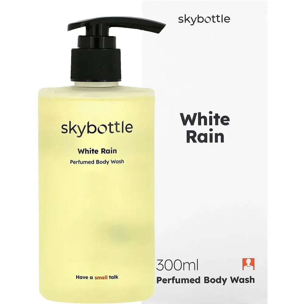 SKYBOTTLE White Rain Duschgel, transparente Flasche mit schwarzem Pumpkopf, neben weißer Verpackung.