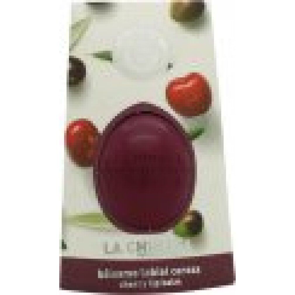 Kirschfarbener Lippenbalsam in Verpackung. Oliven und Kirschen auf der Verpackung. Text: La Chinata, Balsamo labial cereza.