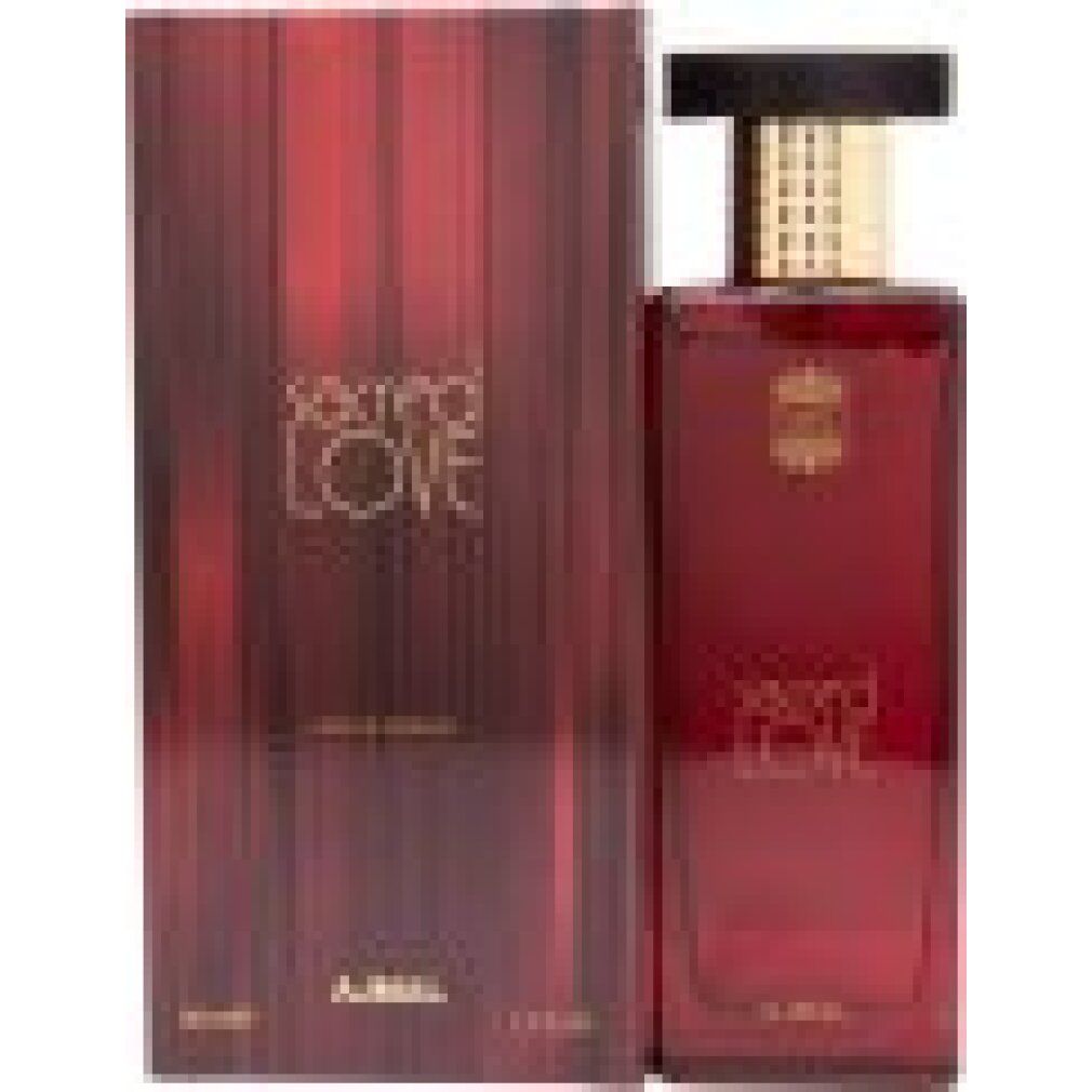 Rote Glasflasche und Verpackung. Aufschrift "sacred LOVE" und "AJMAL".