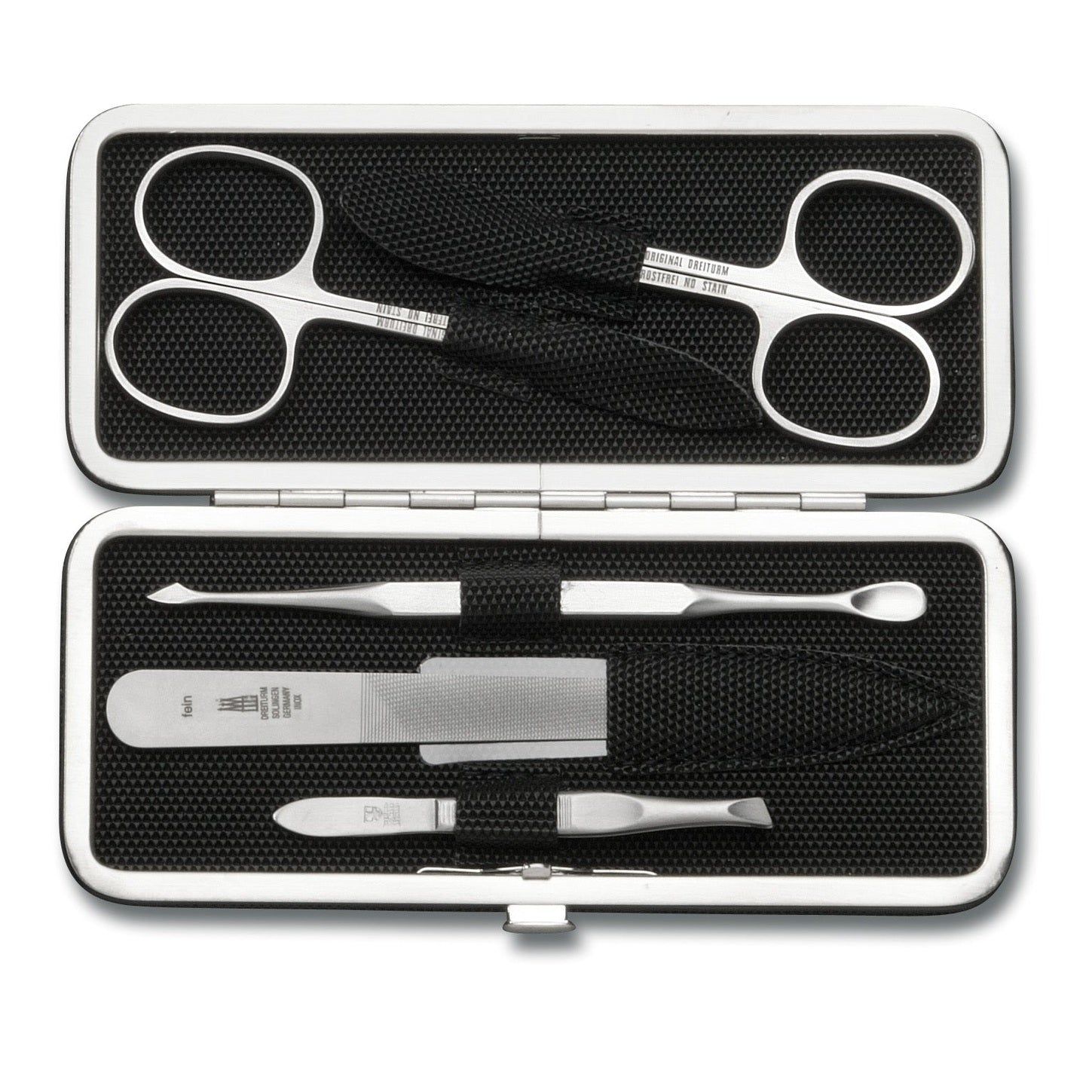 Maniküre-Etui, silberfarbenes Metallgehäuse, schwarzes Innenfutter. Enthält Nagelschere, Pinzette, Nagelfeile und weitere Werkzeuge.