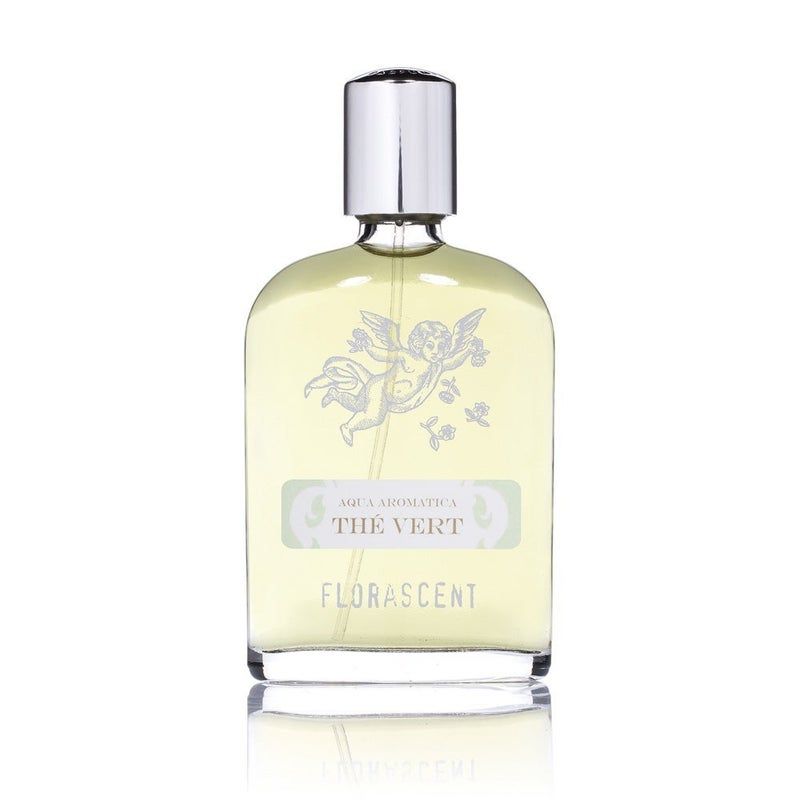 Glasflakon mit silbernem Verschluss. Aufschrift: Aqua Aromatica, Thé Vert, Florascent. Abbildung eines Engels.